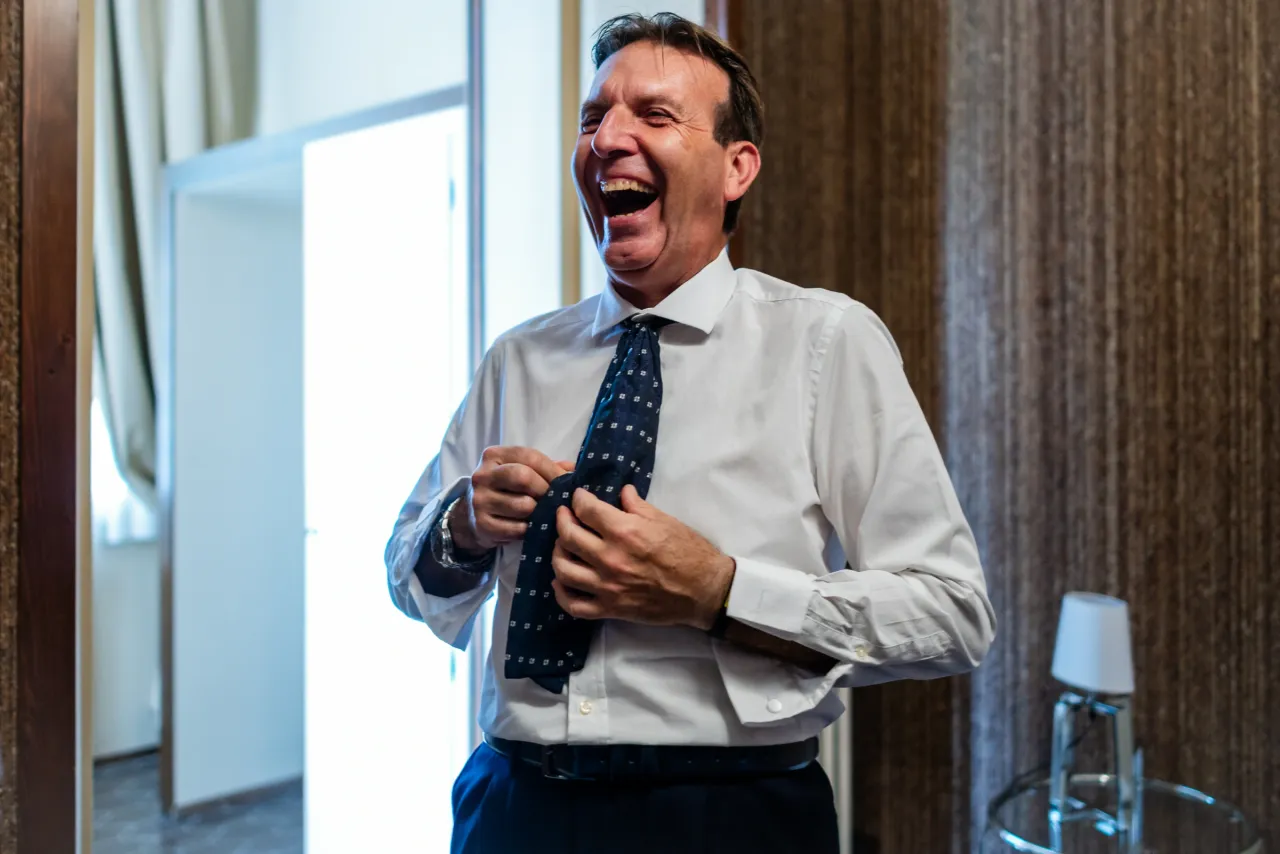 A man laughing during preparations