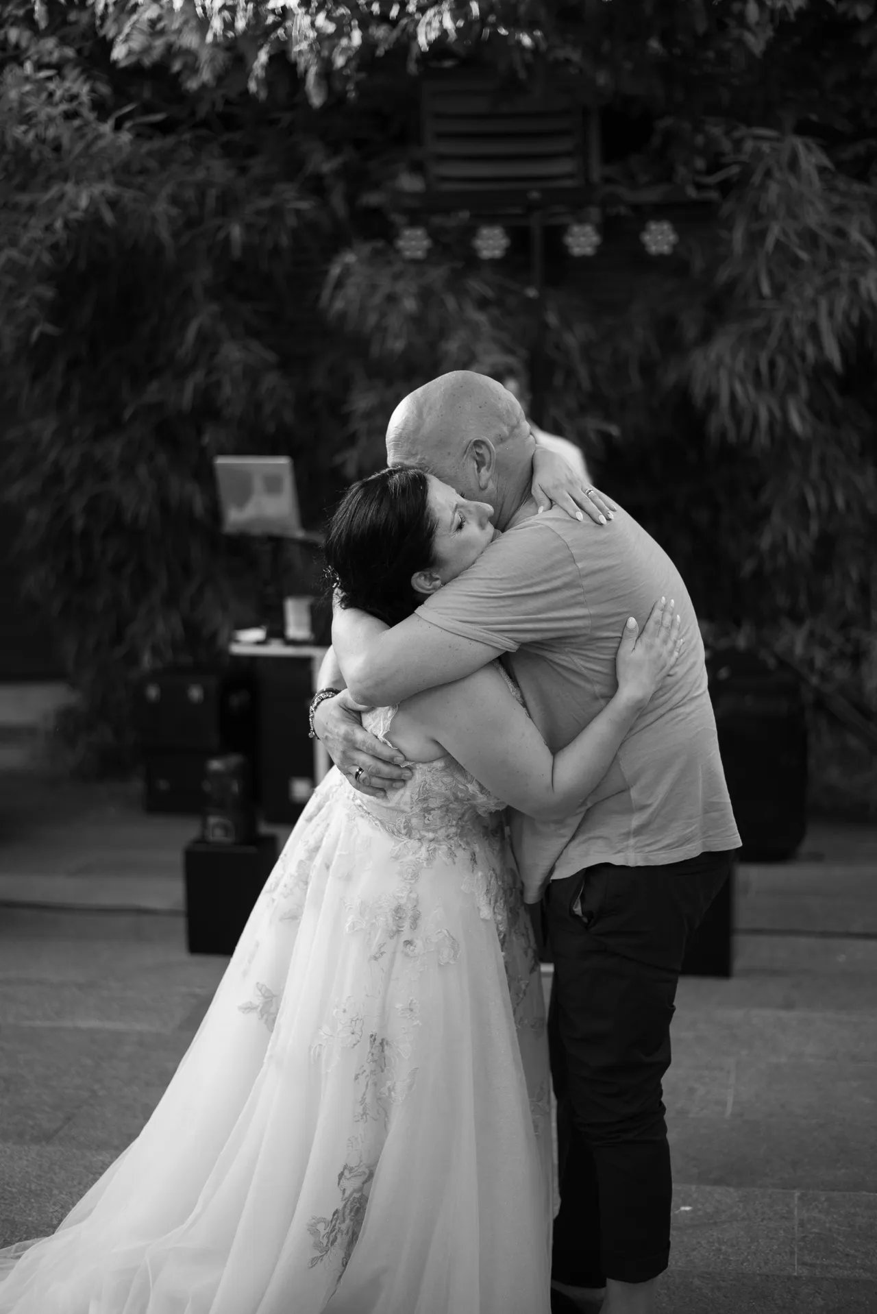 Alessandra dancing in an embrace with her uncle, in black and white