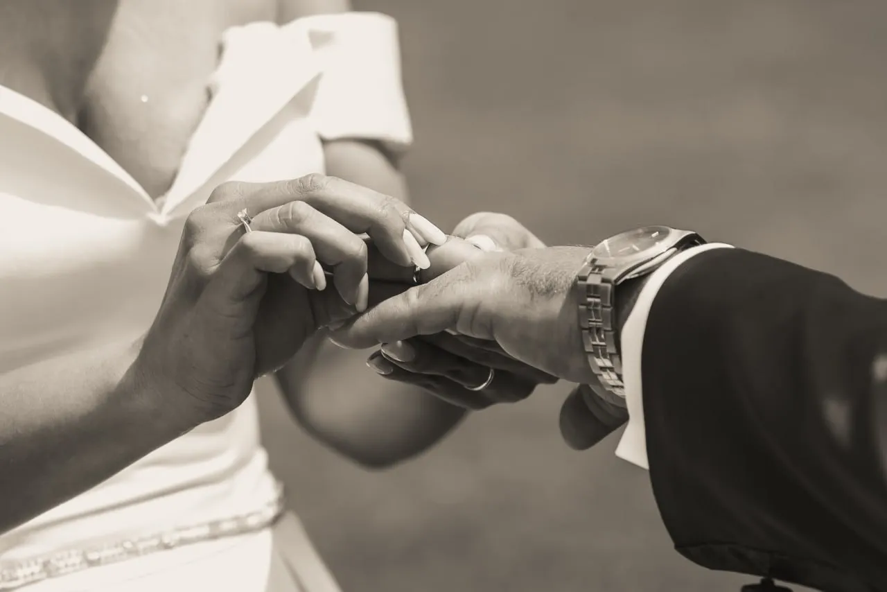 The couple’s hands during the exchange of rings