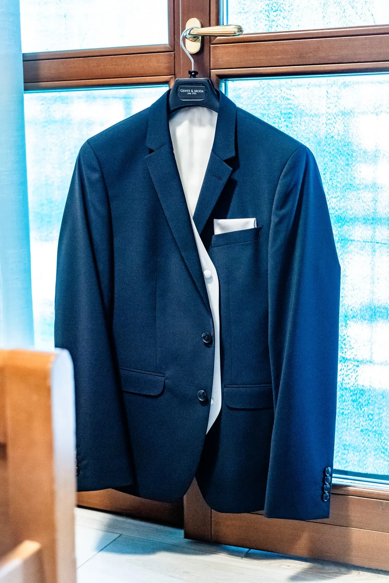 Gianluca’s suit hanging by the window