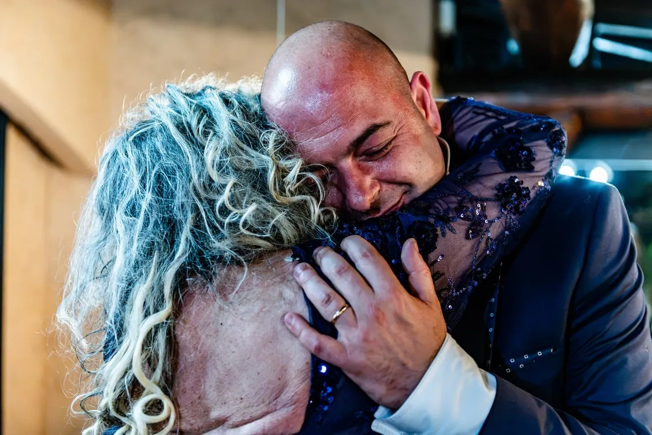 Christian embracing a woman