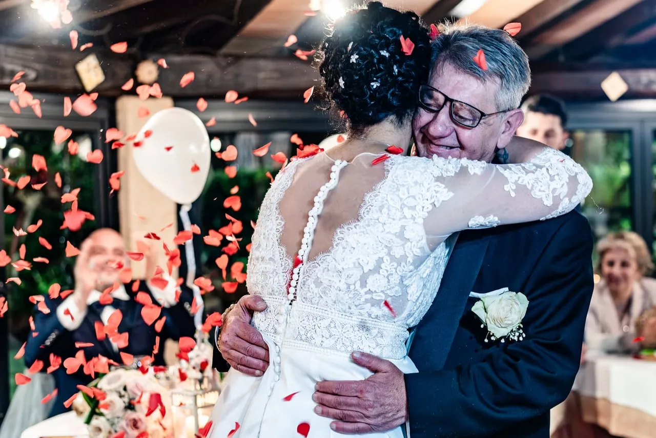 Valentina embracing a man among confetti